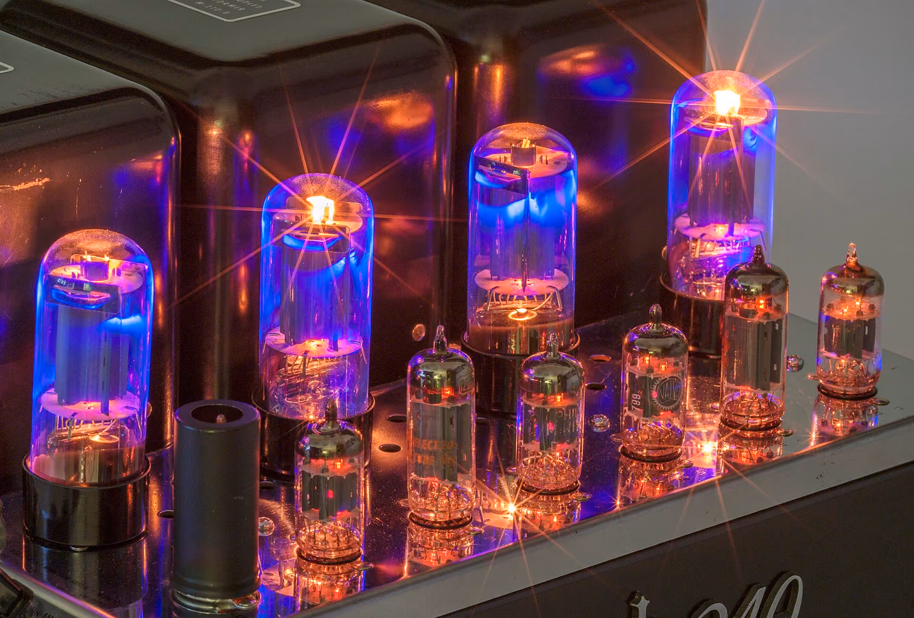 Glowing vacuum tubes of a McIntosh MC240 amplifier — warm analog sound