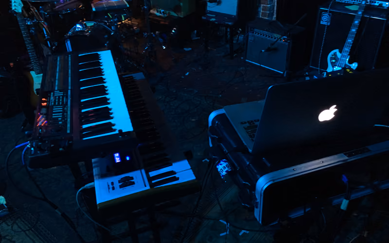 Laptop and MIDI keyboards in a home studio. Photo Mitchschneider88, CC BY-SA 4.0