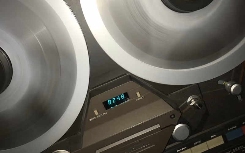 Spinning reel-to-reel tape recorder representing tape speed choices