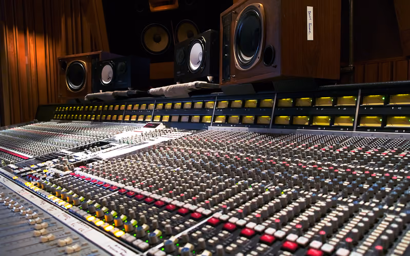 SSL mixing console in a professional mix room — bus compression and mix glue