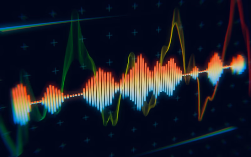 A colorful audio waveform and spectrum analyzer display on a dark screen