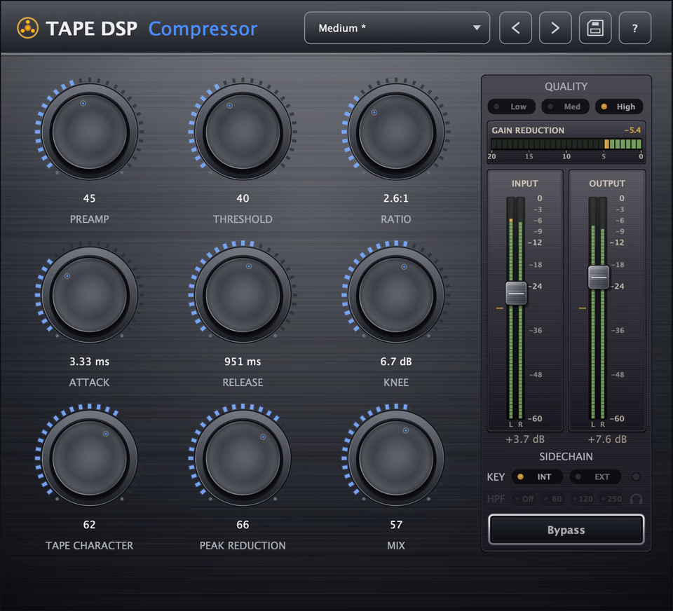 Tape DSP Compressor plugin interface: preamp, threshold, ratio, attack, release, knee, tape character, peak reduction and mix controls with dual VU meters and a gain-reduction meter.